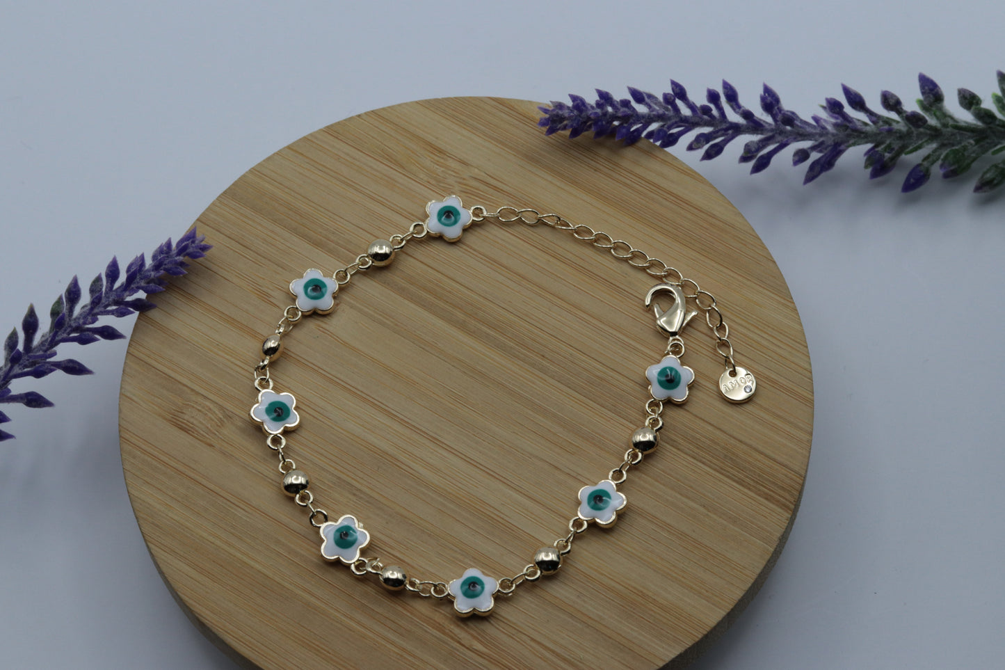 PULSERA GOLD OJITOS